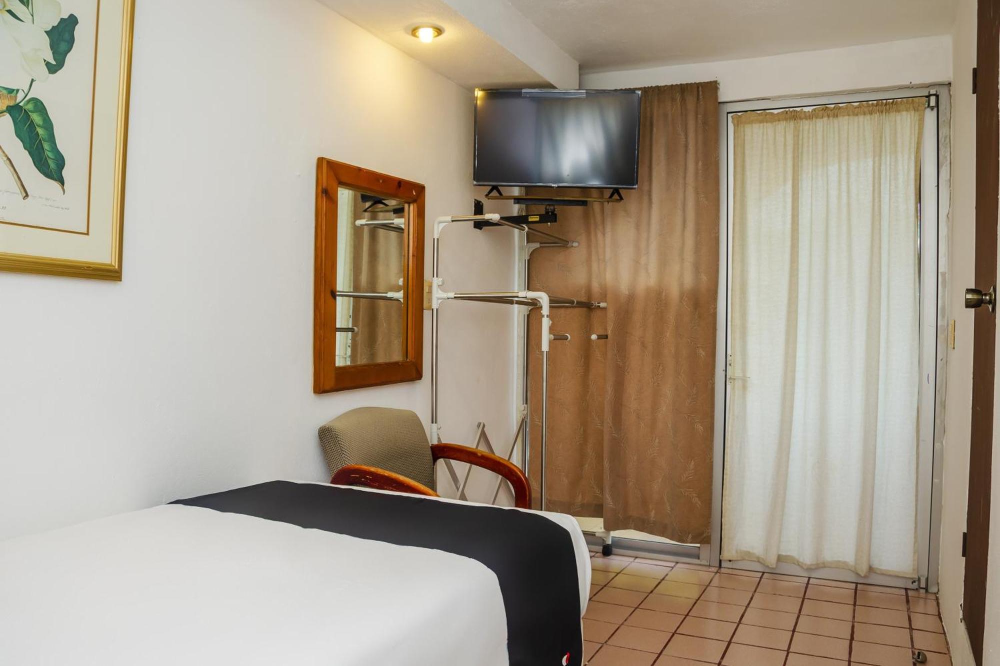 Hotel Capital O Dos Mares,